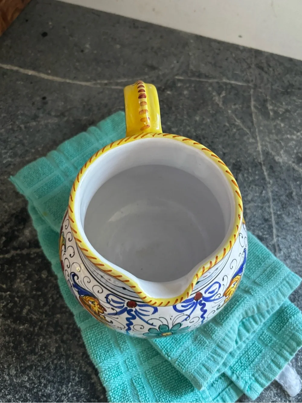 Hand-Painted White Ceramic Pitcher with Yellow, Blue and Green Motif